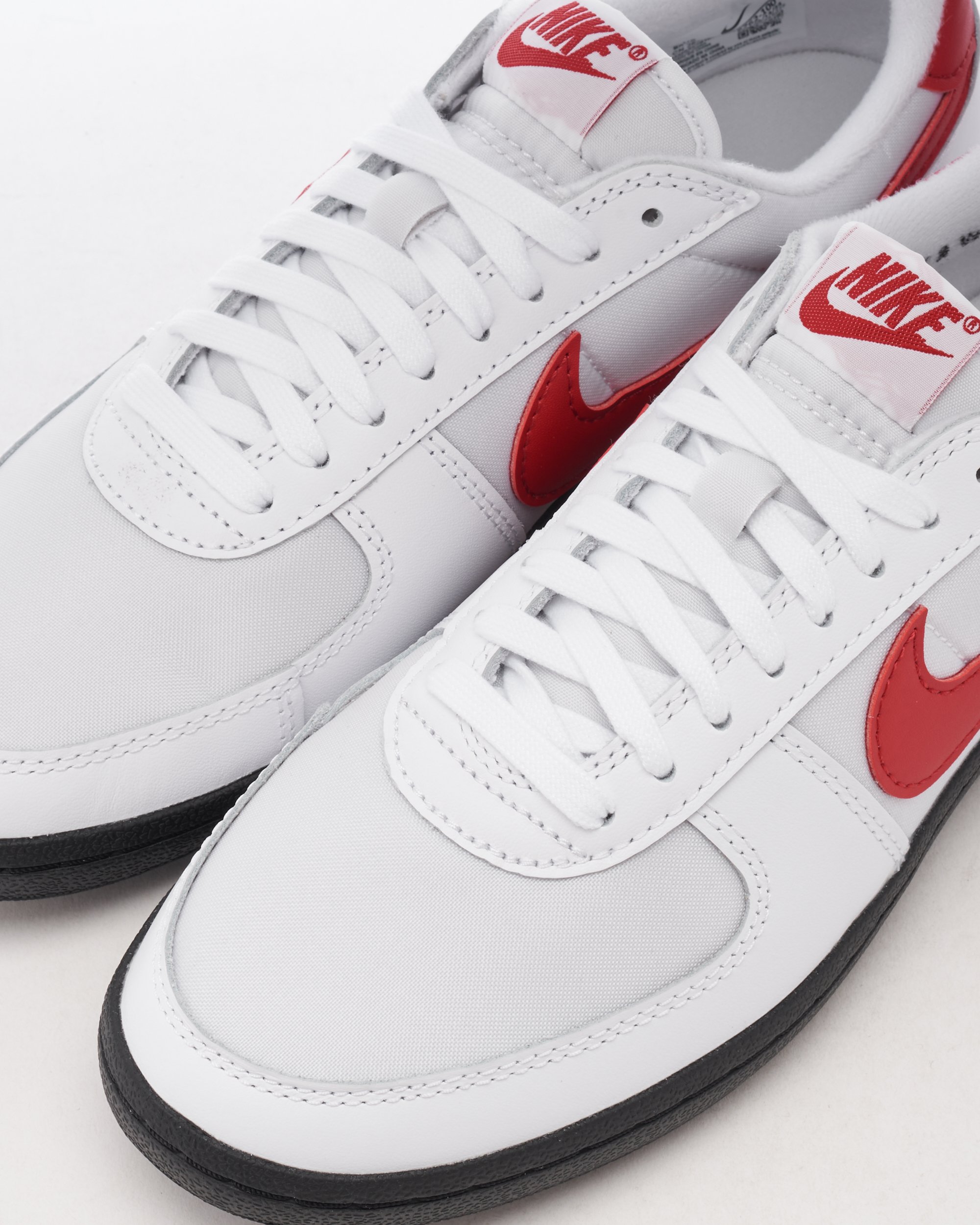 White nike shoes with red swoosh on sale