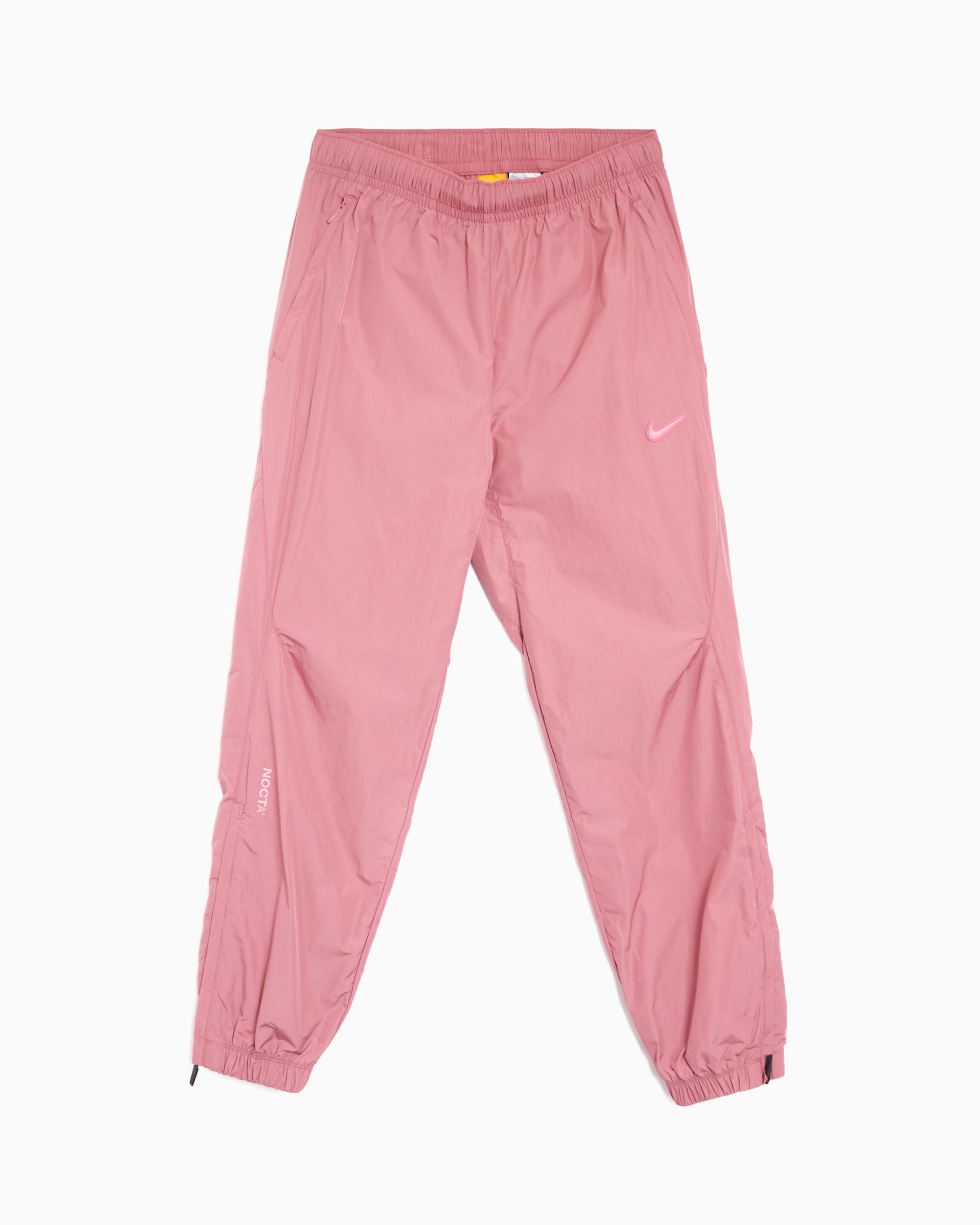 Nike x Drake NOCTA NRG CS Unisex Woven Track Pants Pink FN7668 667 FOOTDISTRICT