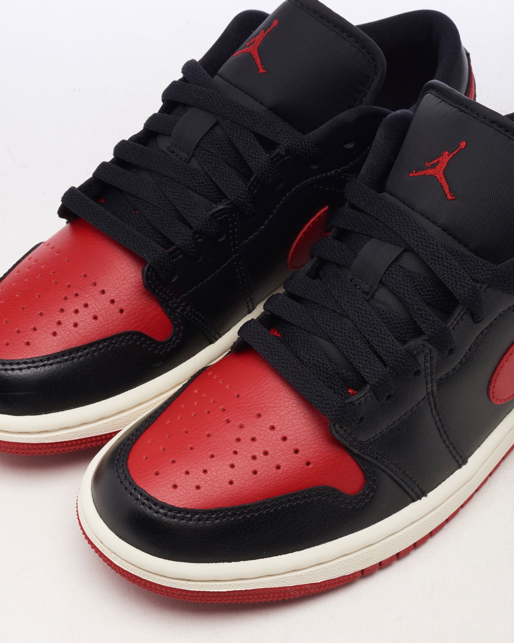 Air Jordan Women s 1 Low Negro Rojo DC0774 061 FOOTDISTRICT