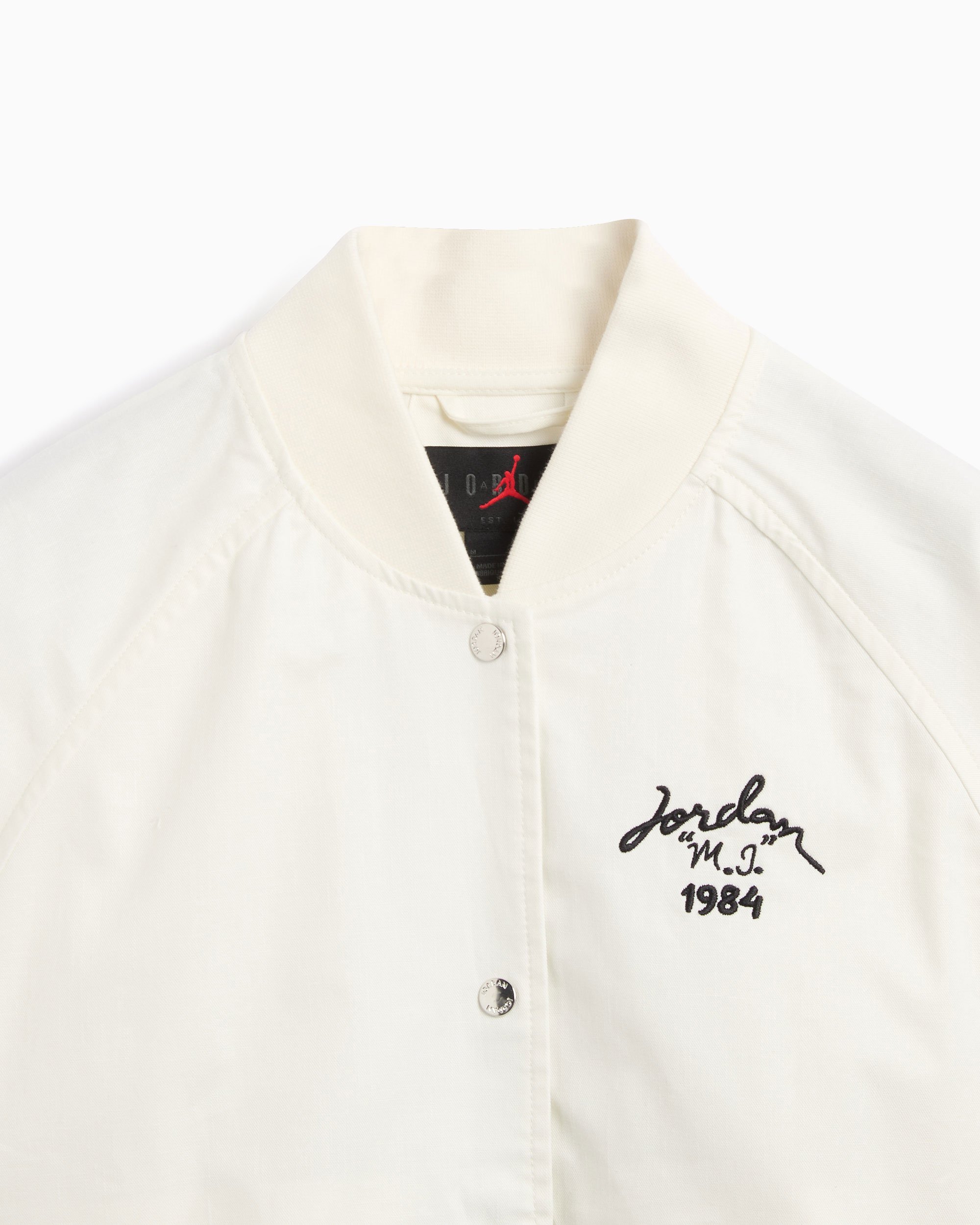 Black and white jordan varsity jacket sales