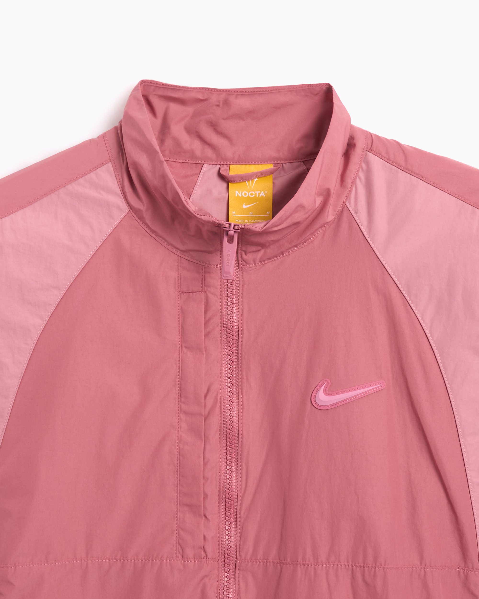 Nike x Drake NOCTA NRG CS Unisex Woven Track Jacket Pink FN7666 667 FOOTDISTRICT