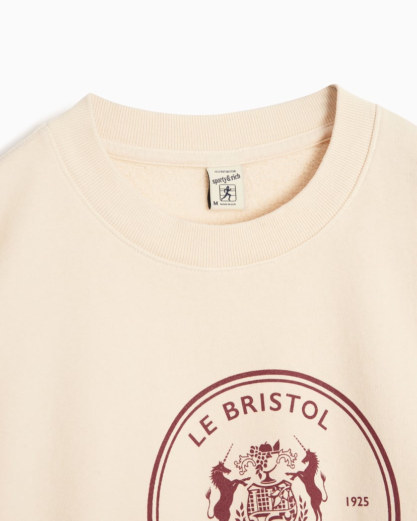 Sporty Rich x Le Bristol Paris Bristol Crest Unisex Sweatshirt Beige CRAW2390CR FOOTDISTRICT