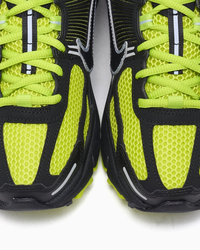 black and yellow nikes women