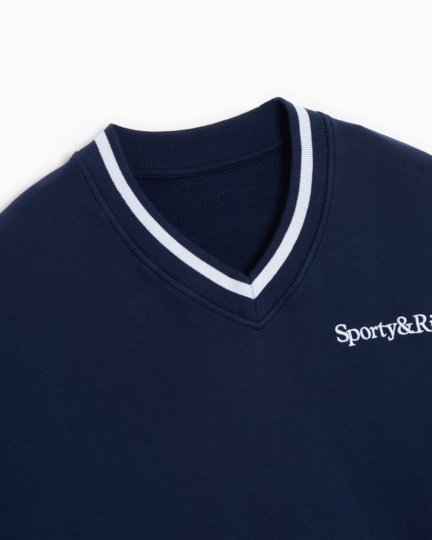 Sporty Rich x Prince Embroidered Serif Logo Women s V Neck Sweater Blau VN831NA FOOTDISTRICT